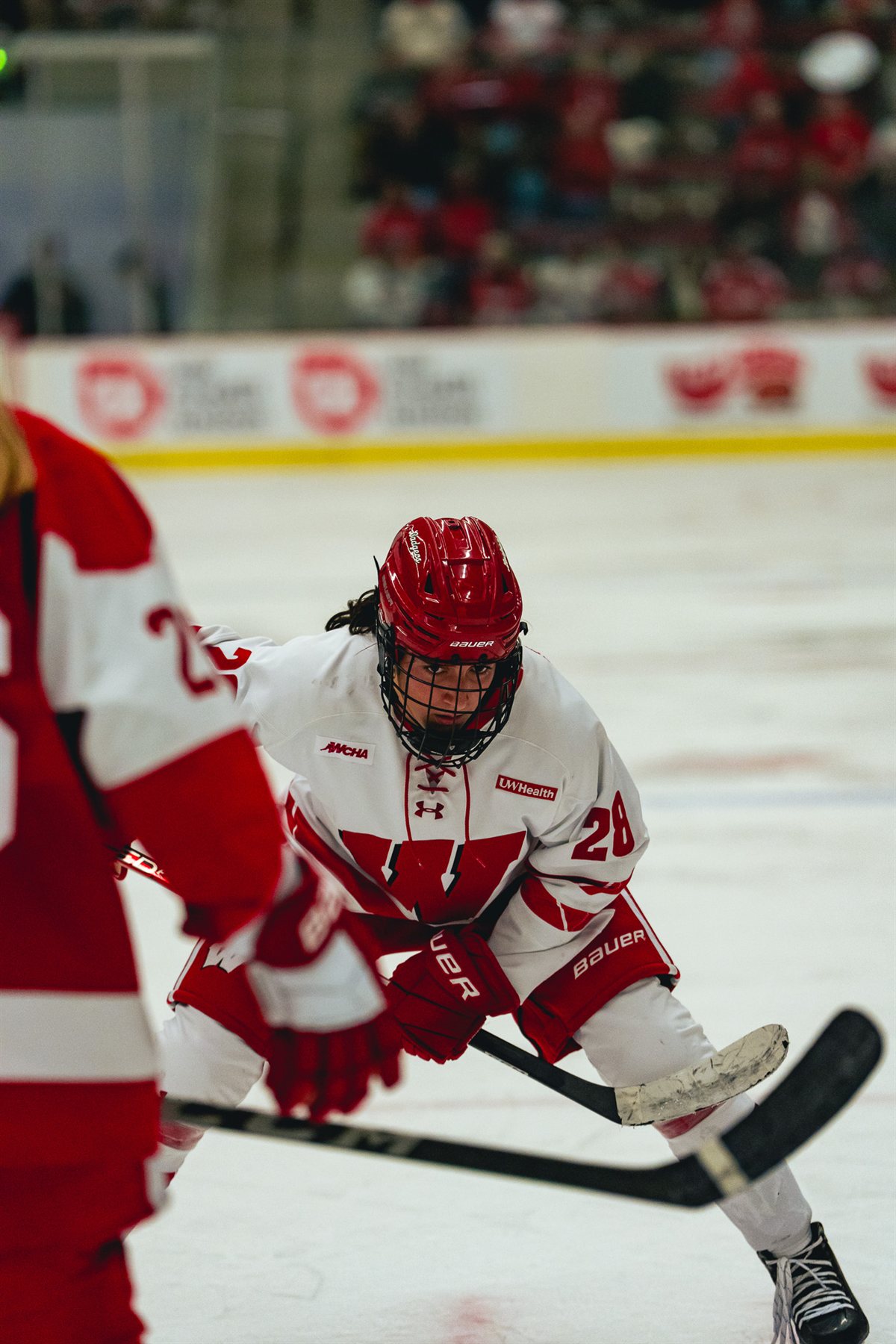 Rosalie Tremblay crouching with her stick on the ice
